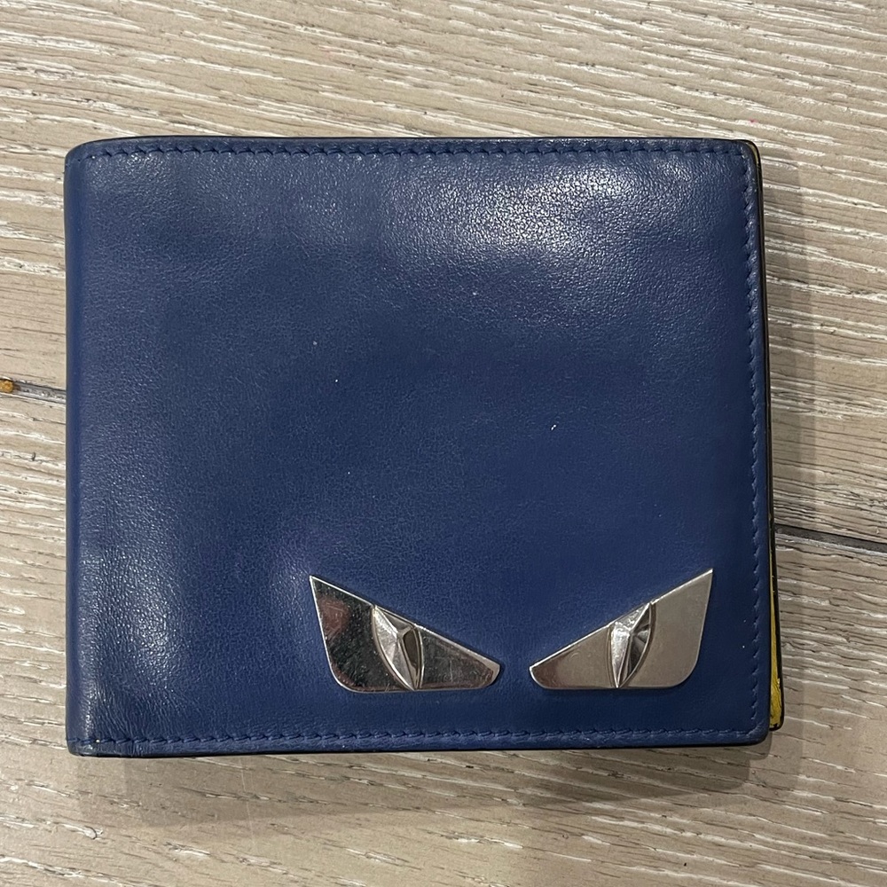 Mens fendi wallet blue with yellow inside.